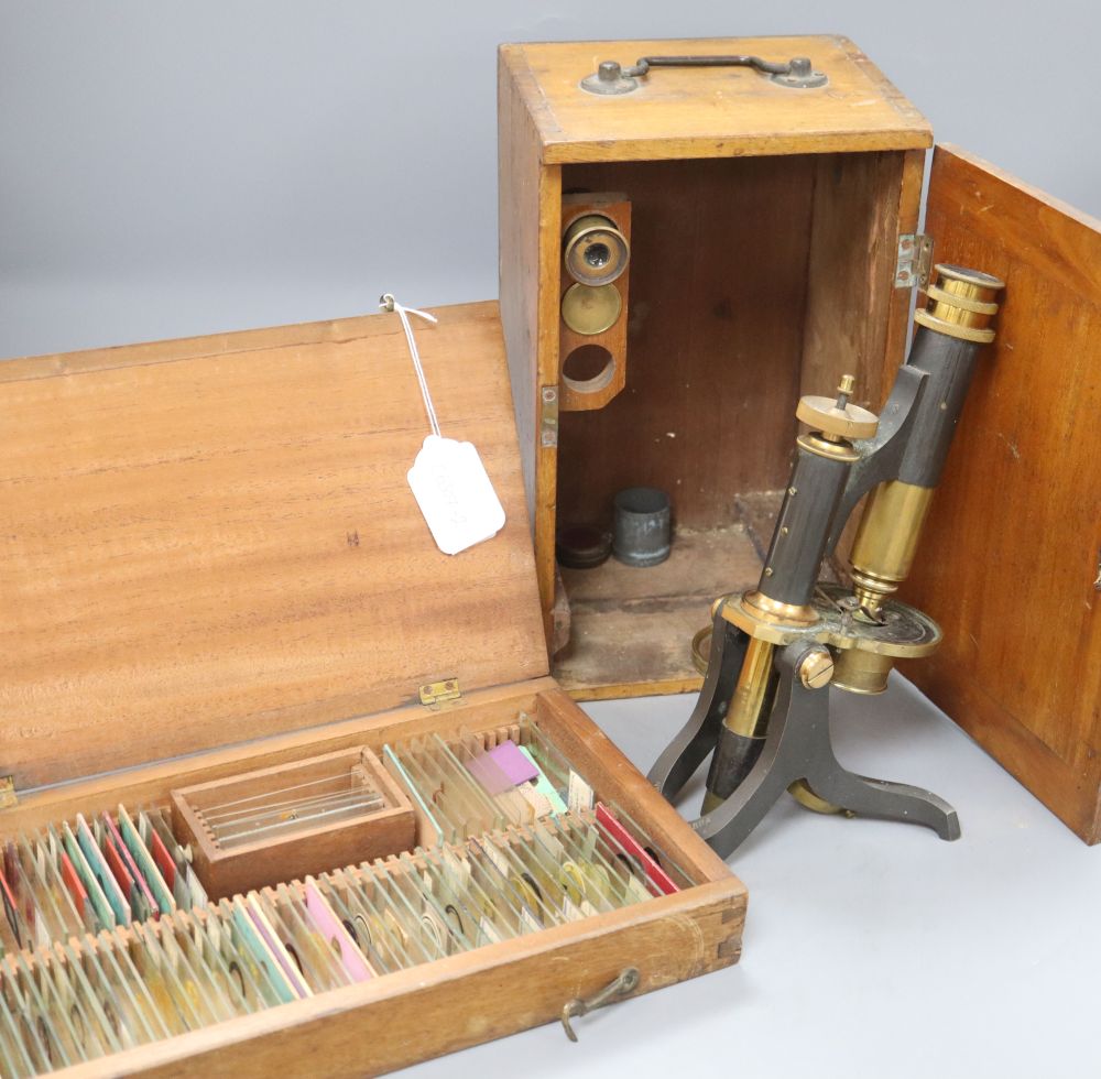 A Negretti and Zambra cased brass microscope and various specimen slides